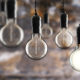 industrial themed light bulbs against masonry wall