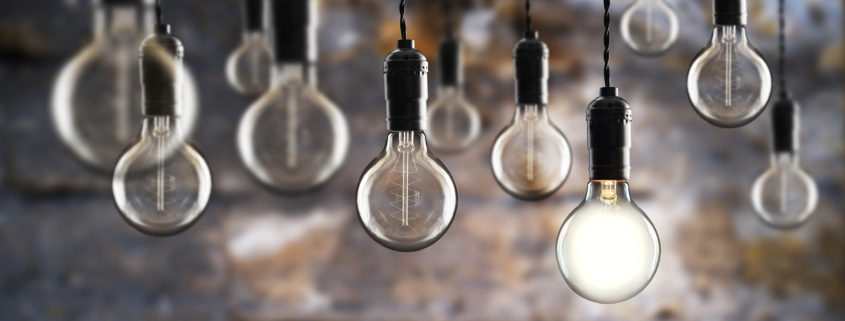 industrial themed light bulbs against masonry wall