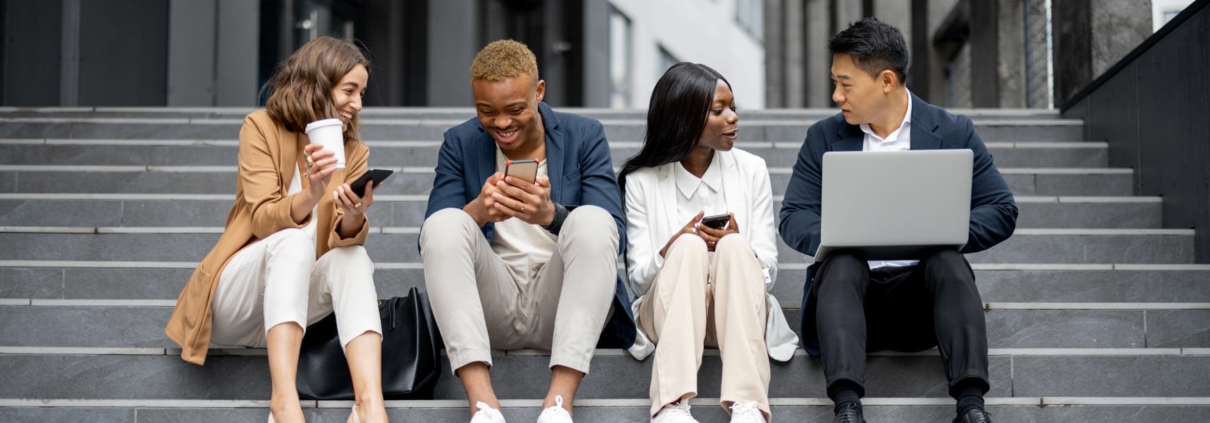 Diverse young adult professionals and college students working together outside