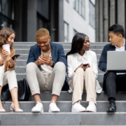 Diverse young adult professionals and college students working together outside