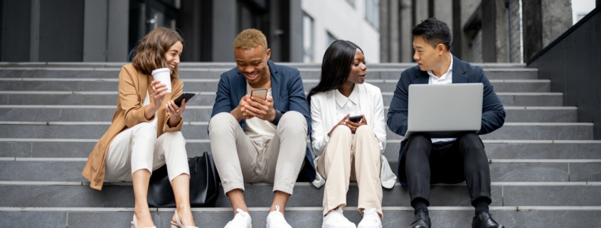 Diverse young adult professionals and college students working together outside