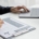 Working IDEAL blog about pay equity - image shows a person reviewing a resume with a laptop on the table